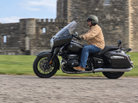 BMW R18 Rider Passing Castle Walls.png